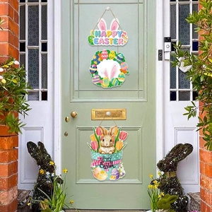 Happy Easter door hanger set with bunny wreath and flower basket on light green door