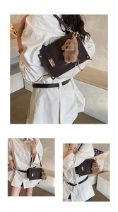 Detailed views of dark brown vintage square bag with golden lock and plush bear charm