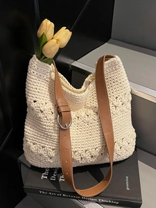 Straw hollow tote bag with adjustable brown leather strap and decorative tulips