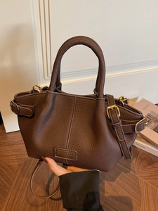 Dark brown lychee pattern bucket handbag with top handles and adjustable shoulder strap