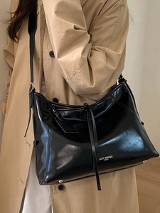 Black glossy large tote bag with shoulder strap and Lazy Breeze Paris print logo