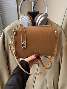 Brown faux suede crossbody square bag with gold hardware and shoulder strap