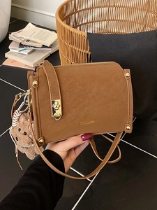 Brown frosted leather small square bag with golden buckle and cute bear pendant