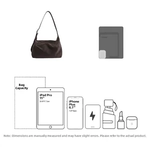 Capacity detail of brown suede hobo bag showing iPad and phone storage space