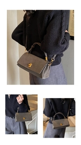 Detail view of the vintage grey suede bag with elegant golden double-ring twist lock