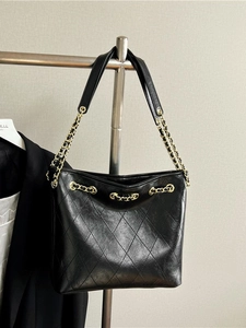 Black quilted tote bag with gold chain strap, luxury style shoulder bag for women