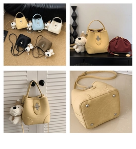 Detail view of lychee texture bucket bags in five colors with cute puppy charms