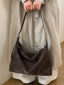 Minimalist large brown faux suede hobo bag with adjustable shoulder strap for women