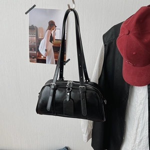 Detailed view of black bowling bag with glossy PU leather and silver metal hardware