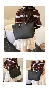 Three-view detail of a large black tote bag with gold metal hardware for daily commute
