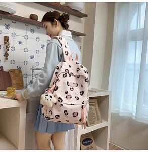 Sac à dos rose à motif léopard pour étudiante avec un porte-clé panda en peluche doux