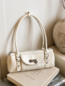 Minimalist cream white cylinder shoulder bag with heart pendant and silver hardware details