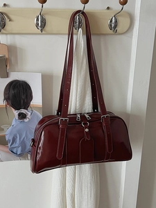 Retro deep red glossy leather Boston shoulder bag with dual metal zippers and long straps