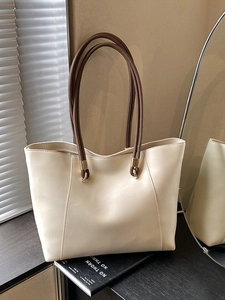 Large cream white faux leather tote bag with brown handles and gold hardware for women