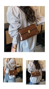 Detail view of a vintage dark brown shoulder bag with a polished finish and gold metal clasp