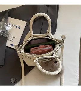 Internal view of beige wrinkled shoulder bag showing large capacity for daily essentials