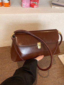 Chic dark brown glossy baguette bag with vintage gold buckle for women