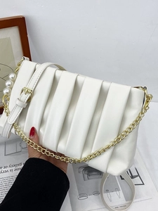 White pleated square shoulder bag with gold chain and large pearl accents