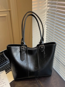 Black large capacity tote bag with oil wax leather texture and silver buckle for women