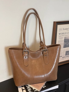 Retro brown large capacity tote bag with adjustable shoulder straps and top zipper closure