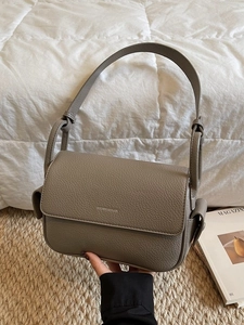 Taupe pebbled leather square handbag with top handle and adjustable shoulder strap