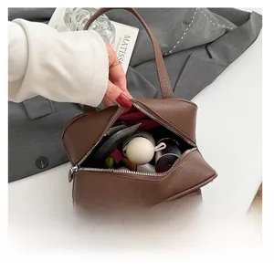 Interior view of brown lychee leather square bag showing daily storage capacity