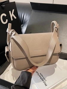 Litchi texture beige leather crossbody bag with brand logo and wide shoulder strap