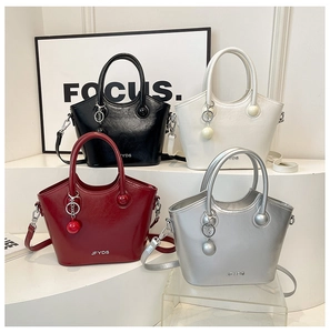 Collection of four minimalist bucket bags in black, white, burgundy, and silver finishes