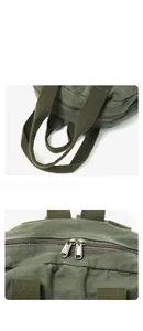 Close-up of wide fabric handles and smooth dual metal zippers on a dark green canvas bag