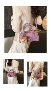 Detail of lavender Boston bag with plush bear charm and adjustable shoulder strap