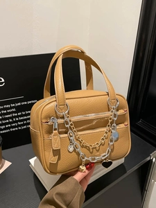 Brown litchi leather Boston bag with dual zippers and heart metal chain detail