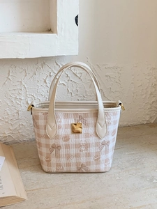 Chic plaid tote bag with cute bear patterns and gold plaque on a beige stone surface
