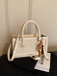 French vintage matte square handbag in cream white with a colorful beaded pendant charm