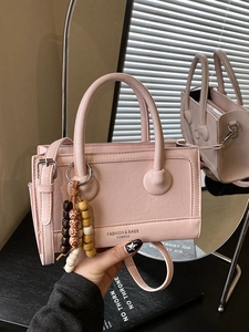 Pink vintage matte square handbag for women with wooden bead charm and shoulder strap