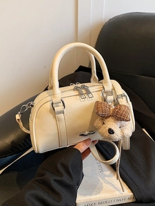 Retro cream leather Boston handbag with bear charm and adjustable shoulder strap