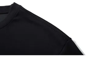 Macro shot of reinforced crew neck and double-stitched shoulder seams on black sports t-shirt