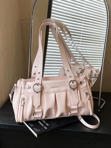 Pink pleated faux leather shoulder bag with chic metal rings and sleek side zippers