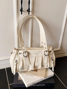 Chic beige patent leather shoulder bag with multiple zippers and pleated moto design