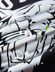 Detail of premium cotton blend knit fabric with metallic silver tiger print and soft texture