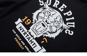 Detail of silver tiger head screen print on heavy cotton black vintage style t-shirt