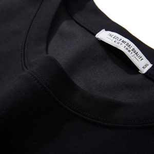 Men's minimalist black crew neck T-shirt featuring a durable ribbed neckline and 5XL size label