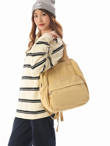 Large beige canvas backpack with zipper pocket, stylish versatile casual travel bag