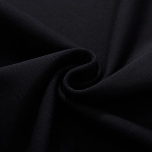 Heavyweight black cotton knit fabric texture with high elasticity and clear grain detail