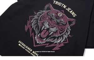 Macro detail of high-density rhinestone tiger head design on black cotton men's T-shirt
