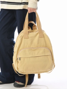 Minimalist beige canvas backpack for women with dual handles and large capacity
