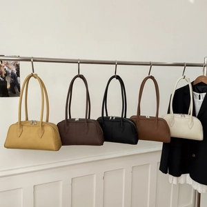 Minimalist Boston handbags in five colors featuring matte leather and dual metal zippers