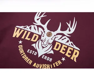 Detail of wild deer graphic and letter print on burgundy oversized sweatshirt fabric
