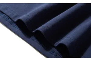 Close-up of twin needle stitching on navy cotton long sleeve shirt hem and cuff