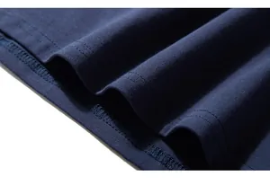 Macro shot of dark blue cotton knit fabric featuring precise double-needle hem stitching