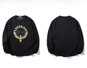 Detail view of black long-sleeve t-shirt featuring golden eagle and letter print